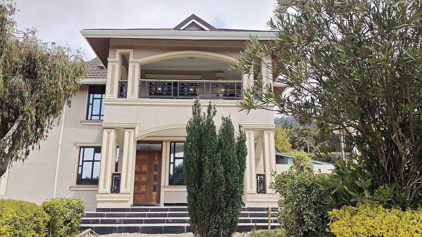 Two-storey residential house with arched balcony